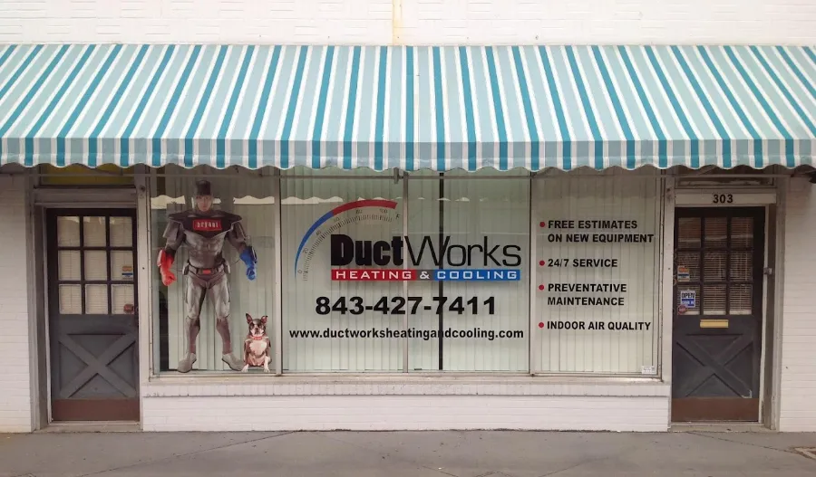 The Ductworks Heating & Cooling storefront with its striped awning